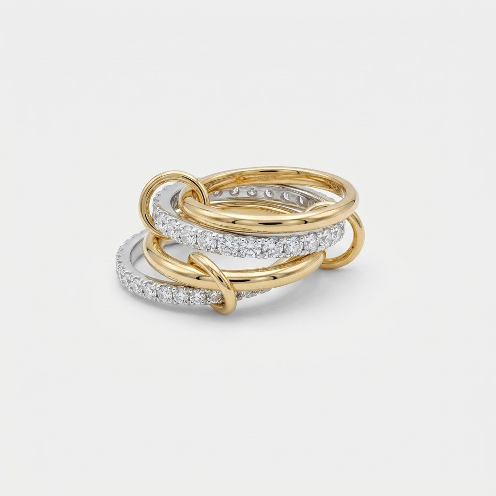 LOCEVIA Ring mit verbundenen gold- und silberfarbenen Ringreihen und funkelnden Schmucksteinen