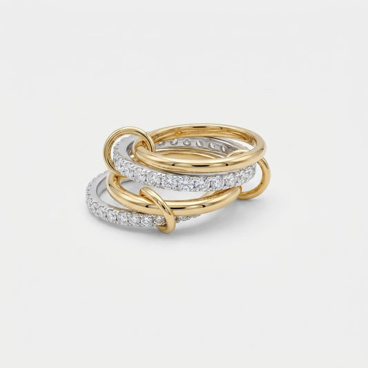 LOCEVIA Ring mit verbundenen gold- und silberfarbenen Ringreihen und funkelnden Schmucksteinen