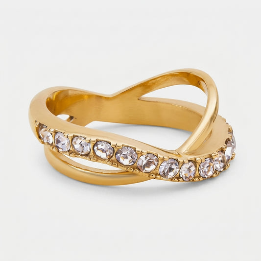 Goldfarbener LOCEVIA Ring mit überkreuzten geschwungenen Linien und einer Reihe runder facettierter Schmucksteine
